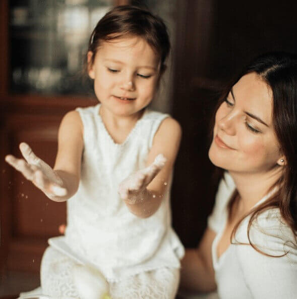 A mother and daughter baking together